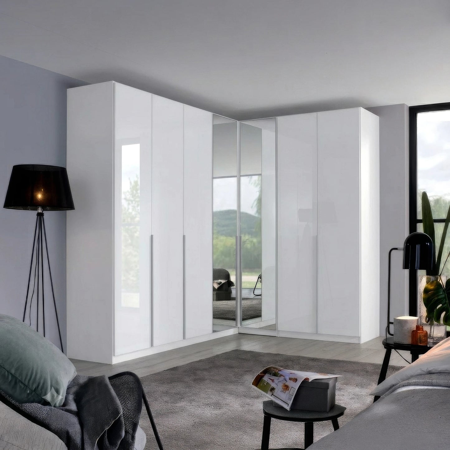 A set of modern white high-gloss Rauch Alabama Corner wardrobe with High Polish White doors with integrated mirror panels, shown in a contemporary bedroom setting.