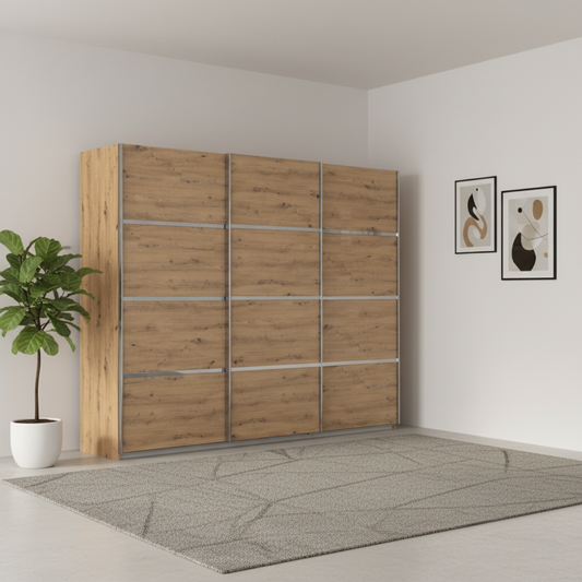 Wooden wardrobe with sliding doors in a room with a plant and framed pictures on the wall.
