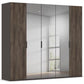 A modern five-door Rauch Atlantic Oak wardrobe or closet with two dark wood-grain side panels and two frosted glass centre doors, shown against a clean white interior background.