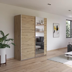 Rauch Aurelia Artisan Oak Sliding Door Wardrobe with Mirror styled in a stylish room