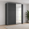 A modern Rauch Aura two-door wardrobe or storage cabinet with two dark gray matte doors,One door has mirrored pads, shown on a plain white background.