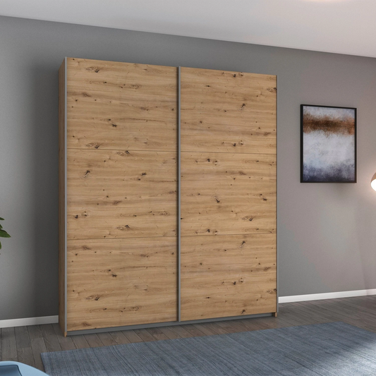 Rauch Aurelia Artisan Oak Sliding Door Wardrobe styled in a modern bedroom