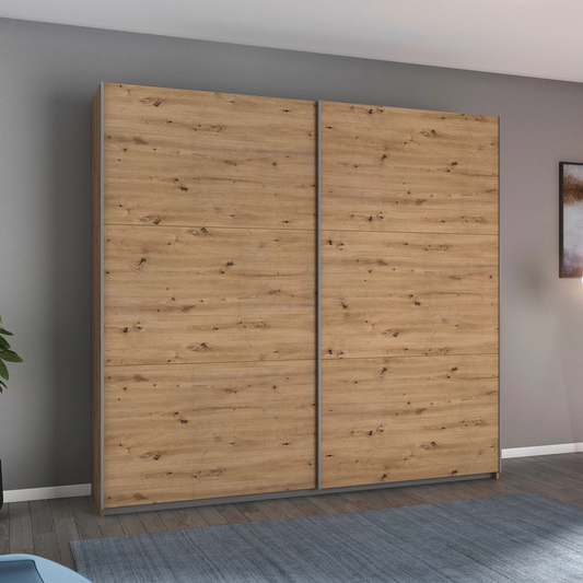 Rauch Aurelia Artisan Oak Sliding Door Wardrobe styled in a modern bedroom