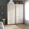 Rauch Aurelia Champagne Sliding Door Wardrobe styled in a modern bedroom