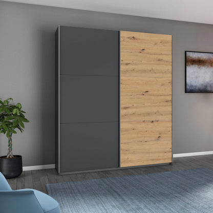 Rauch Aurelia Metallic Grey & Artisan Oak Sliding Door Wardrobe styled in a modern bedroom