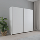Rauch Aurelia White Sliding Door Wardrobe styled in a modern bedroom