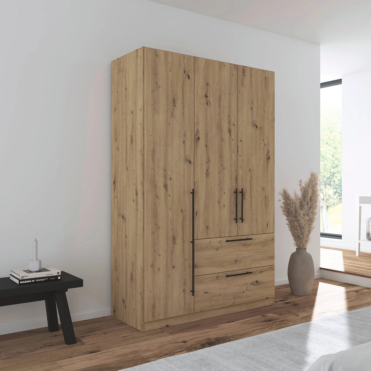 Rauch Avola 3 Door, 2 Drawers Combi Wardrobe 136cm in Oak styled in a modern bedroom