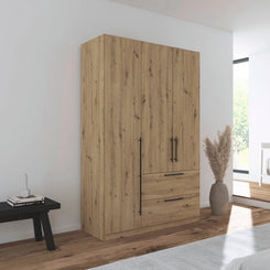 Rauch Avola 3 Door, 2 Drawers Combi Wardrobe 136cm in Oak styled in a modern bedroom