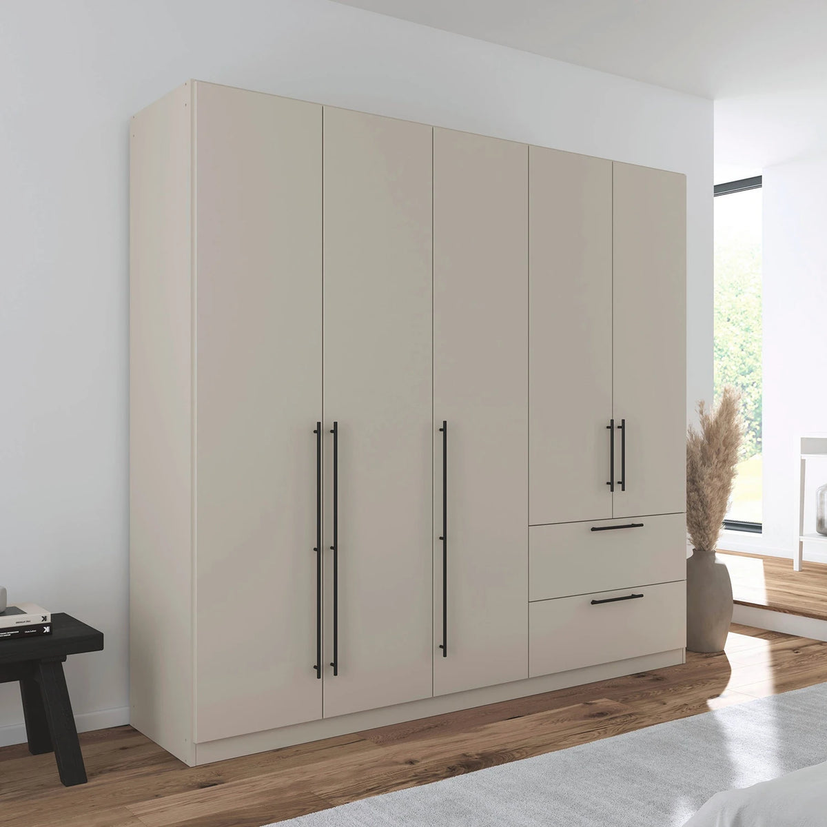 Rauch Avola 5 Door, 2 Drawers Combi Wardrobe 226cm in Champagne styled in a modern bedroom