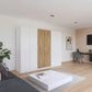 Rauch Miro 6 Door Hinged Wardrobe 271cm in Alpine White with Artisan Oak styled in a modern bedroom