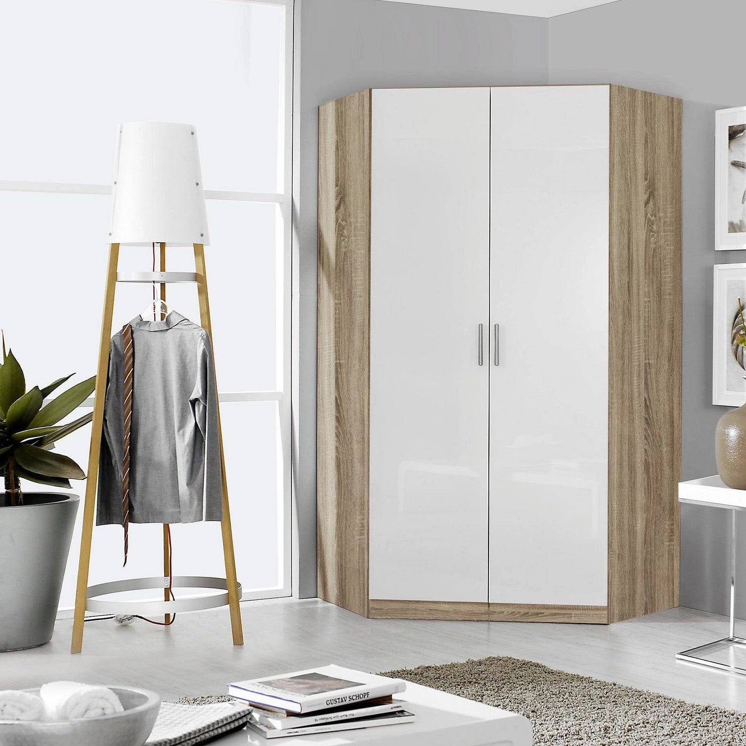 Rauch Celle Light Textured Oak Carcase With High Gloss White 2 Door Corner Wardrobe - Styled in a Bedroom