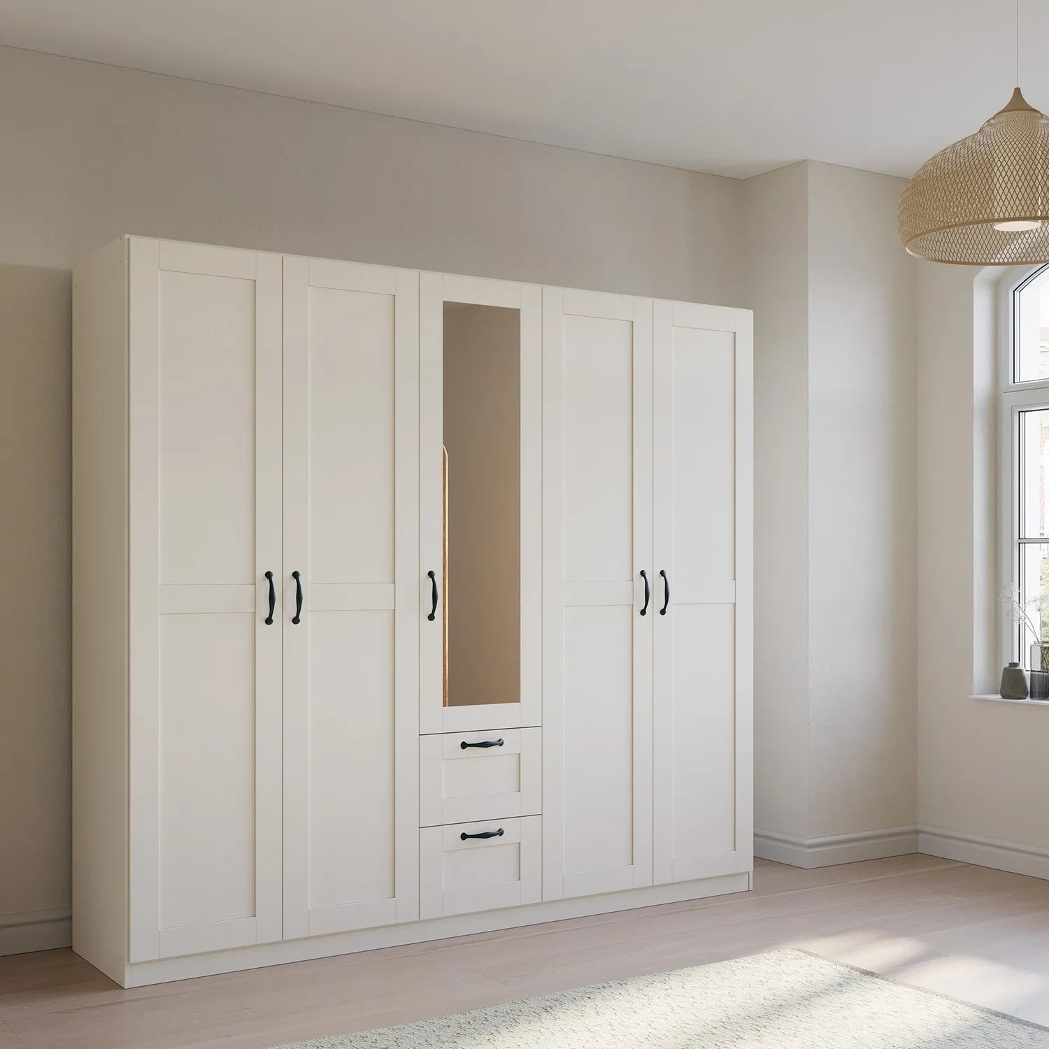 Rauch Cottage 226cm Wide 5 Door Wardrobe with Drawers & Mirror - Styled in a Bedroom