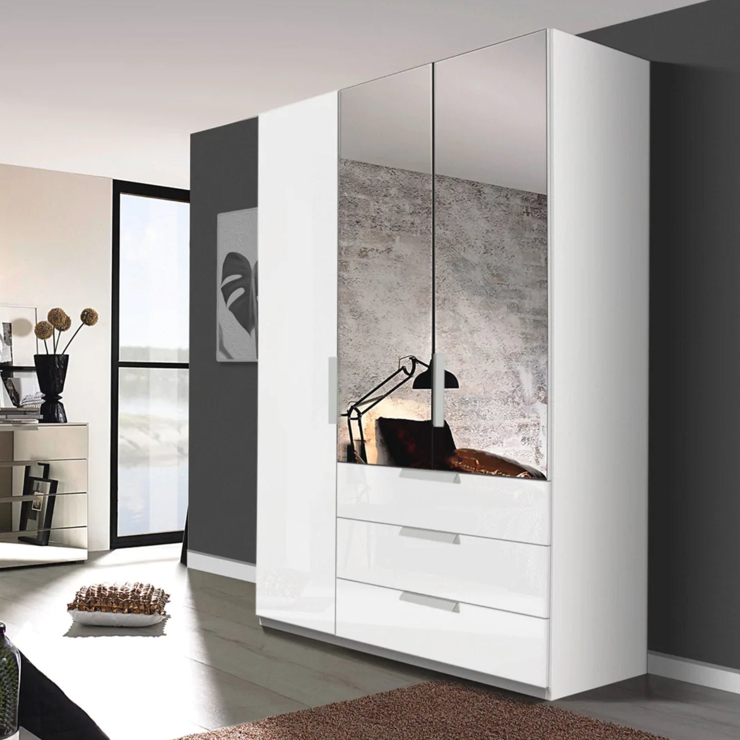 Rauch Crystal 3 Door Colour Glass & Mirror Wardrobe with Drawers in White - Styled in a Bedroom