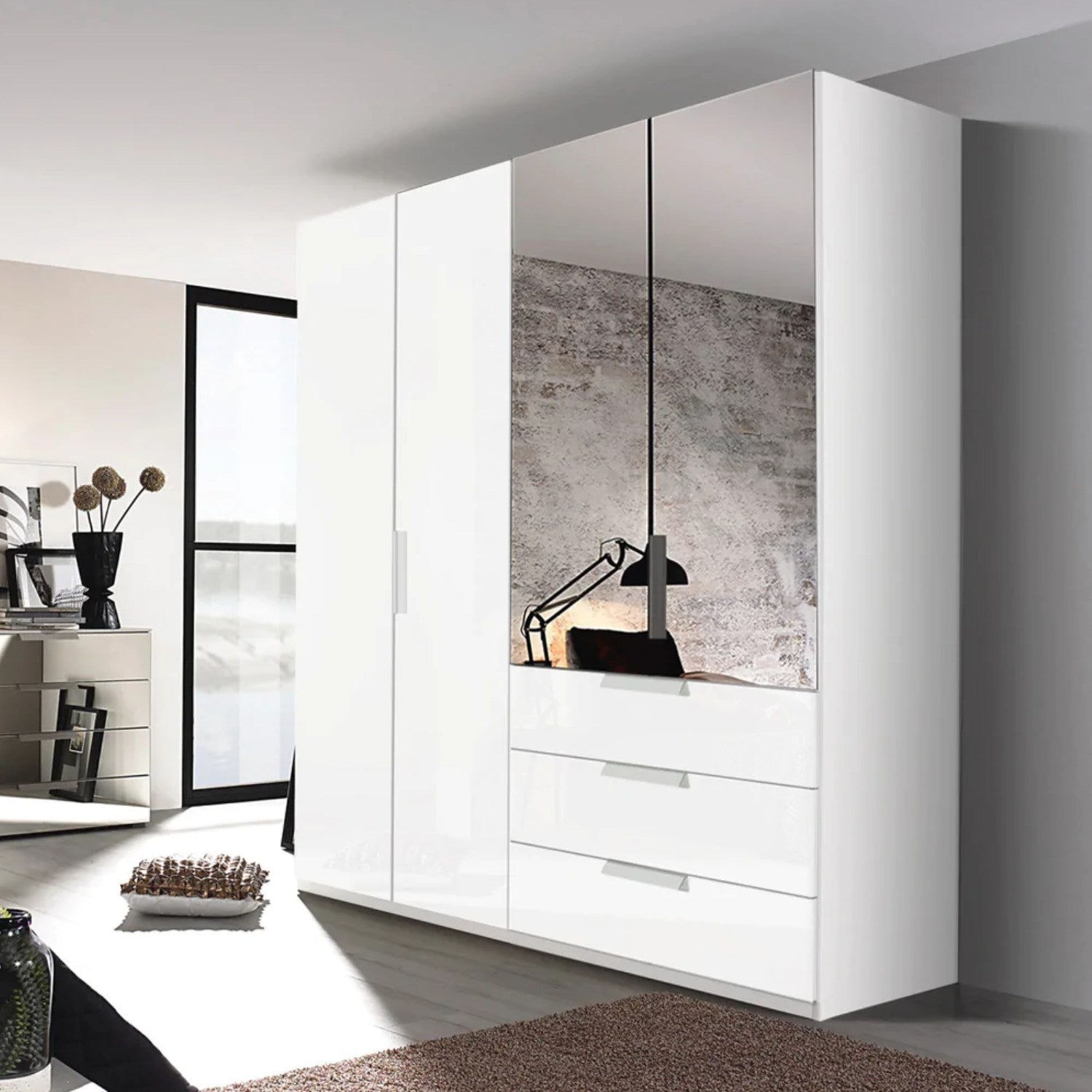 Rauch Crystal 4 Door Colour Glass & Mirror Wardrobe with Drawers in White - Styled in a Bedroom