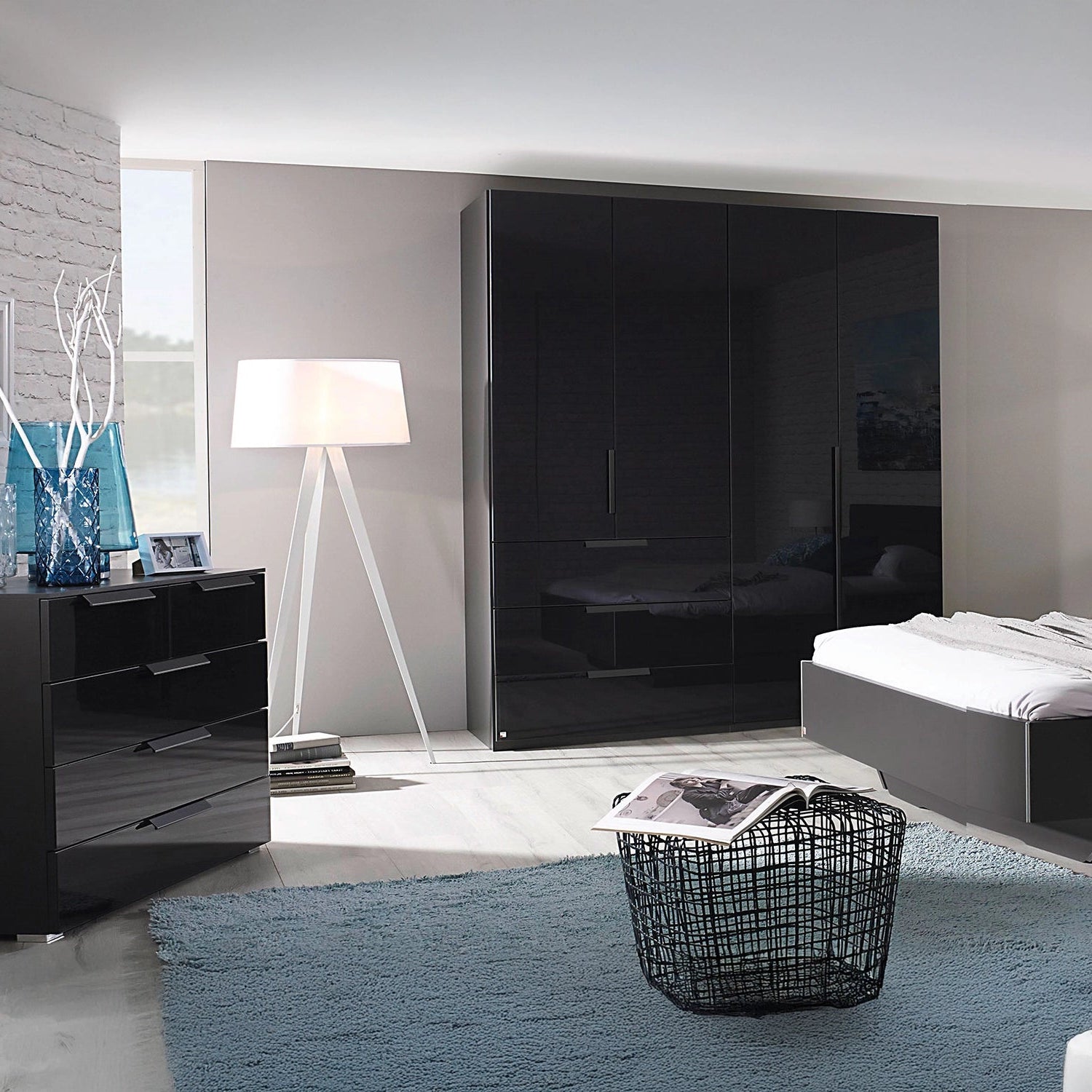 Rauch Crystal 4 Door Colour Glass Wardrobe with Drawers in graphite styled in a bedroom