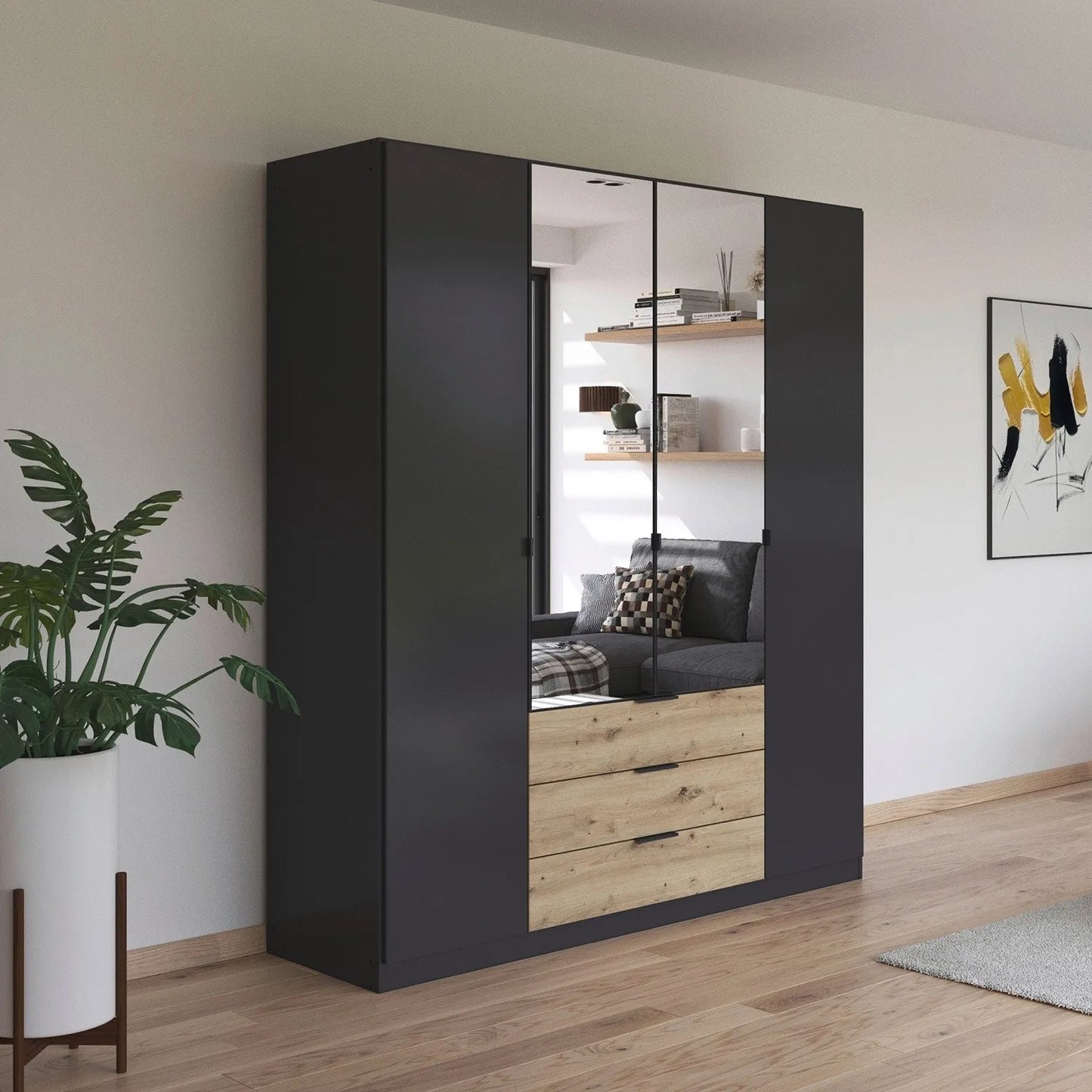 Rauch Davo 4 door wardrobe in metallic Grey with mirror doors and Artisan Oak drawers