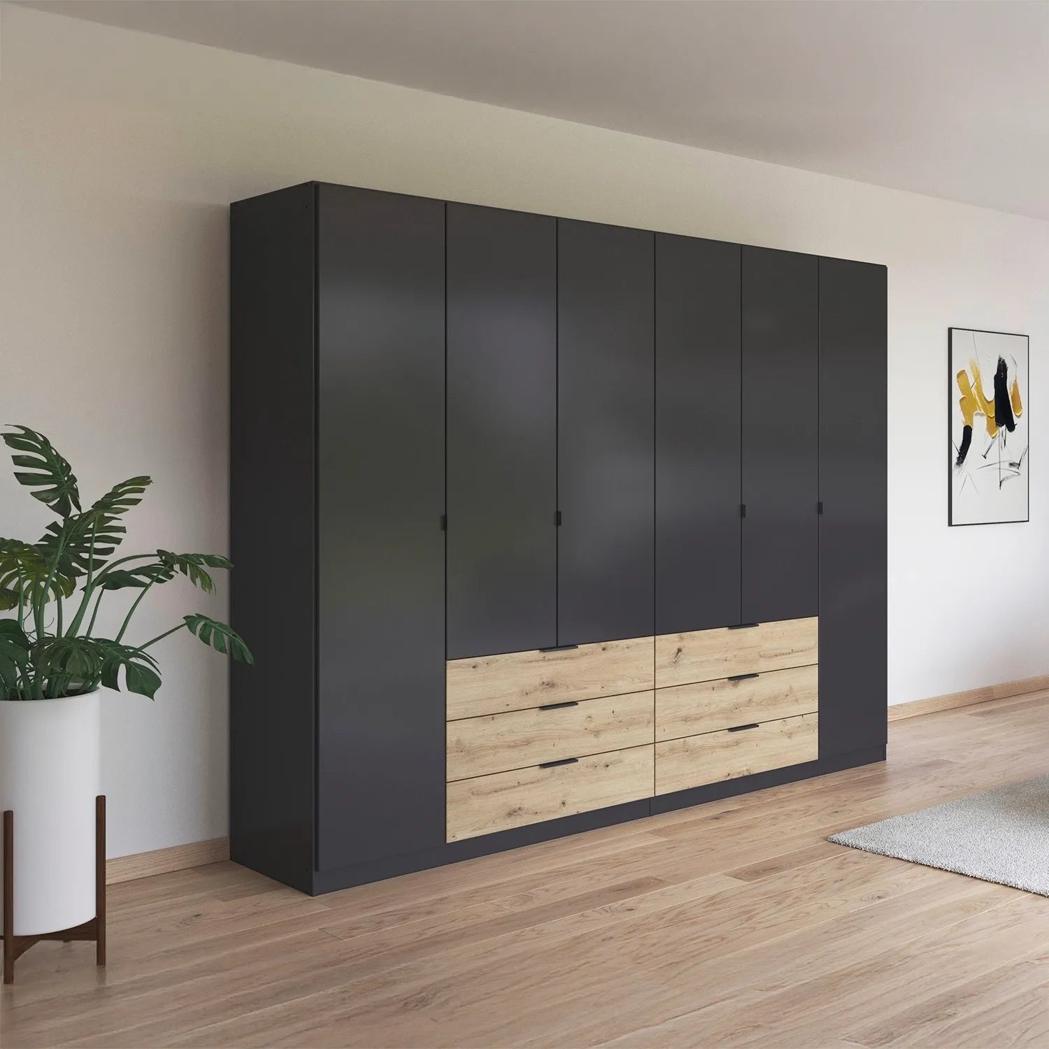 Large black wardrobe with wooden drawers in a room with a plant and artwork on the wall.
