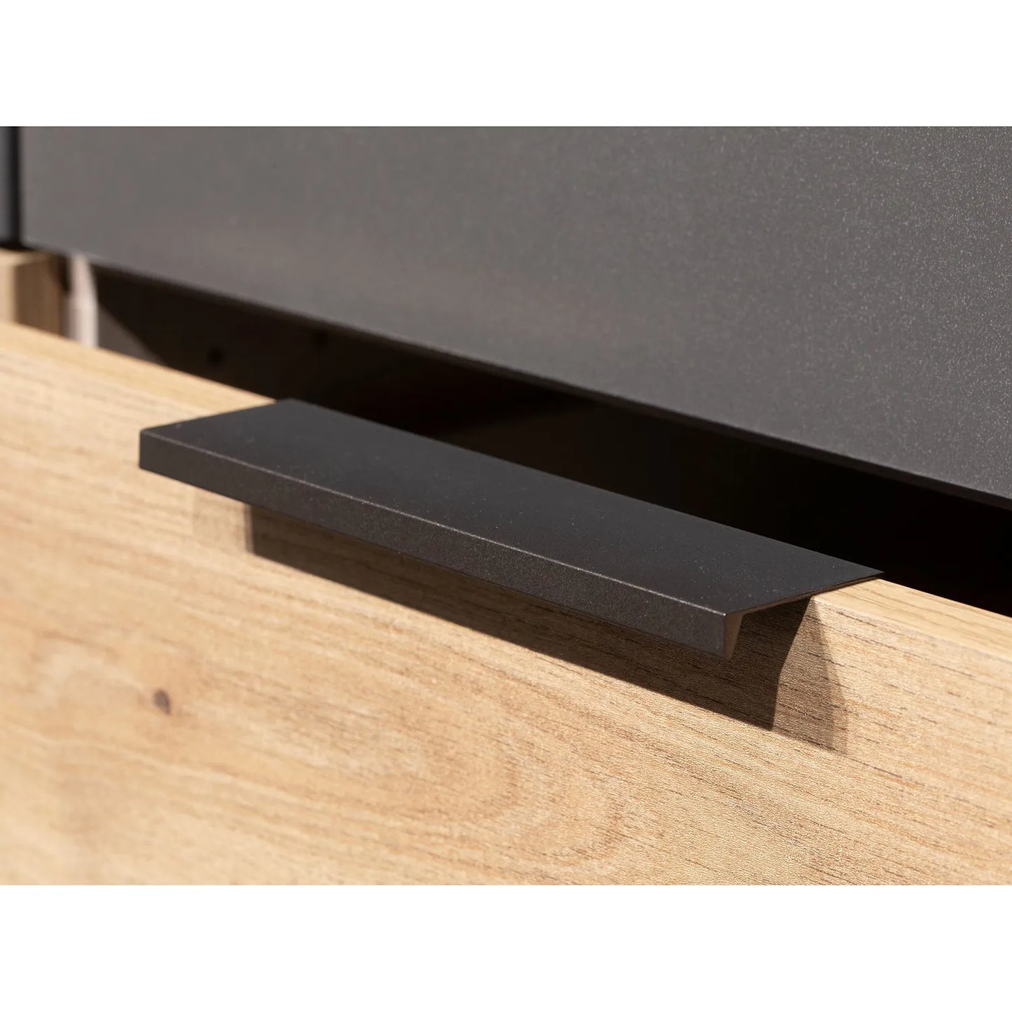 Black metal handle on a Rauch Davo 4 door wardrobe with mirror doors and Artisan Oak drawers