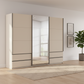 Modern Rauch Elara Champagne three door Sliding Wardrobe With Exterior Drawers, Middle Mirror Door and Slate Handle Bars