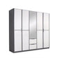 A modern Rauch Essensa five-door wardrobe with a dark gray frame and white doors, featuring a central mirror and two drawers at the bottom center, shown on a plain white background.