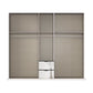 A modern wardrobe or closet organizer with three sliding doors in a warm taupe-beige fabric, featuring two silver metal pull-out drawers at the bottom center and horizontal hanging bars inside.
