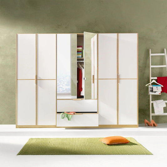 Rauch Essensa Front colour with vertical and horizontal trims 6 Doors, 2 Mirrored Doors & 2 Drawers in Sonoma Oak - Styled in a Bedroom