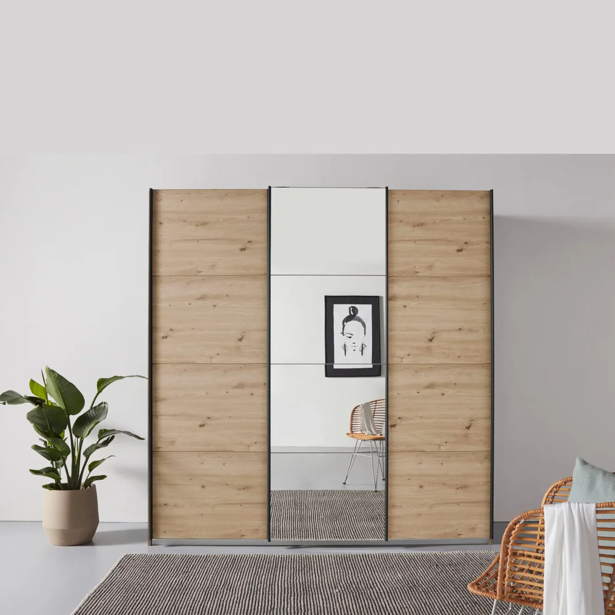 Rauch Forms Artisan Oak & Mirror 3 Door Sliding Wardrobe - Styled in a Bedroom