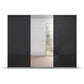 Basalt glass Forms sliding wardrobe showing the Silk Grey base plinth beneath the dark doors and mirror