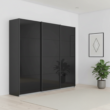 German-made Rauch Forms 3 door sliding wardrobe with basalt tempered glass fronts – a near-black dark grey. 203cm or 271cm wide. Free delivery.
