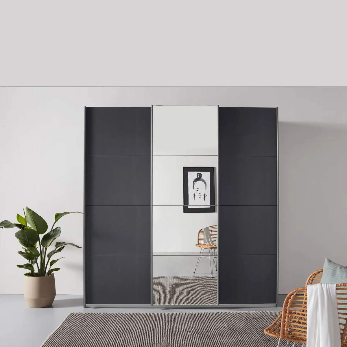 Rauch Forms Metallic Grey & Mirror 3 Door Sliding Wardrobe - Front view Styled in a Bedroom