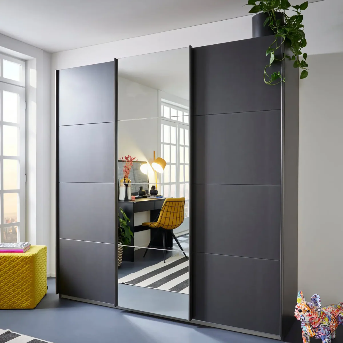 Rauch Forms Metallic Grey & Mirror 3 Door Sliding Wardrobe - Styled in a Bedroom