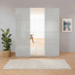 Rauch Forms Silk Grey Glass 3 Door Sliding Wardrobe with Mirror - Styled in a Living Area