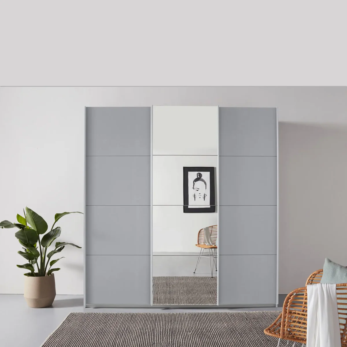 Rauch Forms Silk Grey & Mirror 3 Door Sliding Wardrobe - Styled in a Bedroom