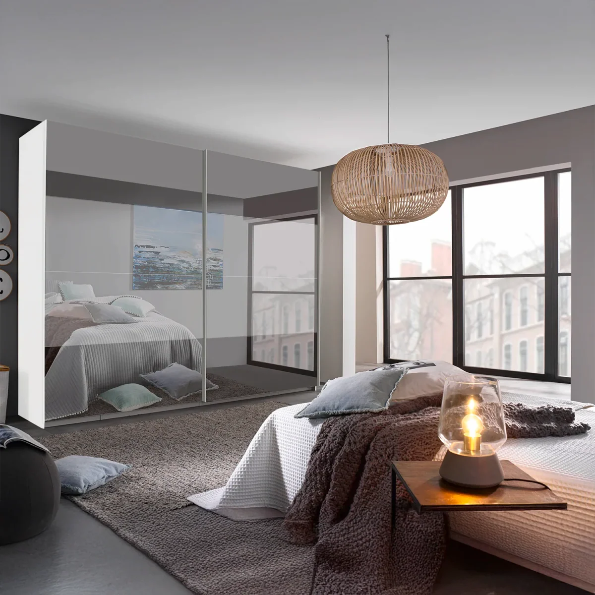 Rauch Frankfurt Two Tone Mirror Front Sliding Door Wardrobe - W316cm - Styled in a Bedroom