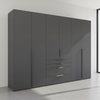 A modern dark gray wardrobe with six doors and three drawers, featuring slim vertical handles, shown in a minimalist room setting.