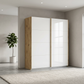 Rauch Freja Glass Door Sliding Wardrobe in White front with Oak Carcase styled in a modern bedroom