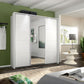 Rauch White Forms sliding wardrobe W203cm showing the Silk Grey base plinth beneath the white and mirrored doors and Passepartout Light Frame