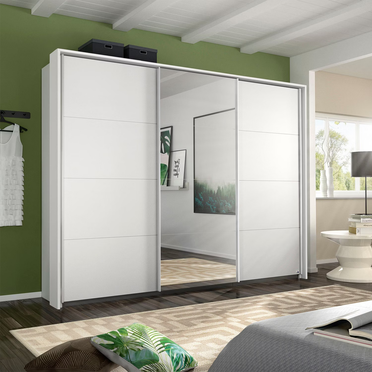Rauch Forms three door sliding wardrobe Width 271cm  in matt white décor with a mirrored centre door and Passepartout Frame
