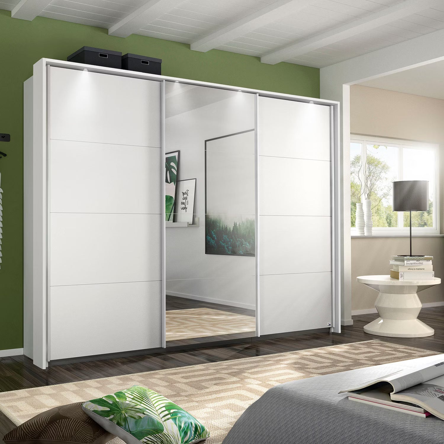 Rauch Forms three door sliding wardrobe Width 271cm  in matt white décor with a mirrored centre door and Passepartout LED Light Frame
