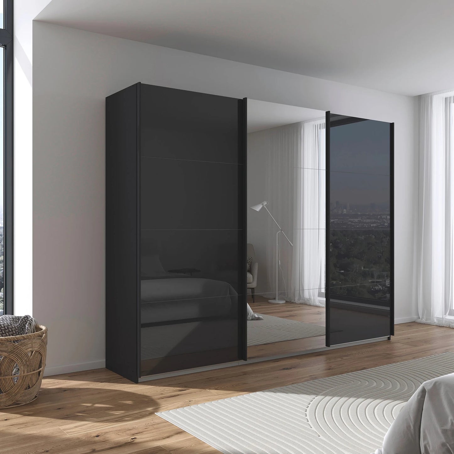 Rauch Forms three door sliding wardrobe with basalt black glass fronts and a mirrored centre door
