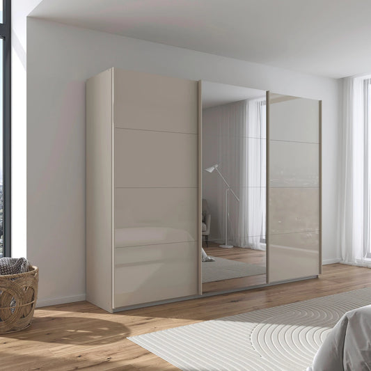 German-made Rauch Forms 3 door sliding wardrobe with champagne tempered glass fronts and a mirrored centre door. 203cm or 271cm. Free delivery.