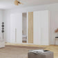 Rauch Lamela 271cm Hinged Door Wardrobe With Mirror in Alpine White styled in a room