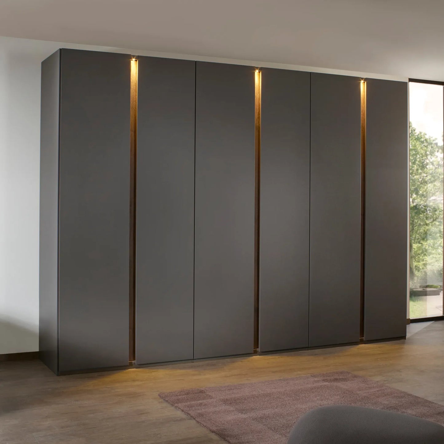 Rauch Larisa large six door hinged wardrobe in graphite with Atlantic Dark Oak panels between the doors and LED Lights