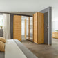 Rauch Lema 4 Door Sliding Corner Wardrobe - Artisan Oak - Styled in a Bedroom