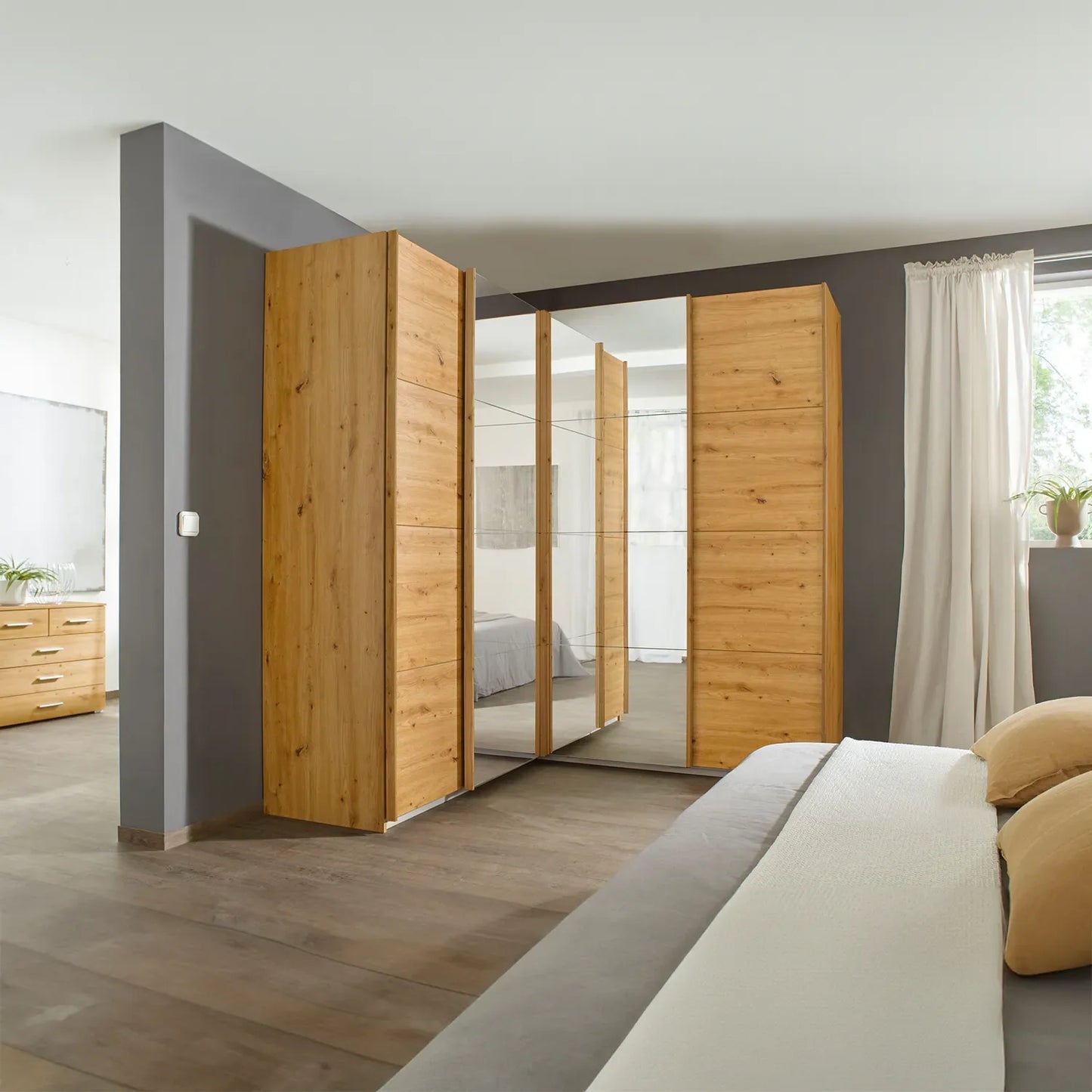 Rauch Lema 4 Door Sliding Corner Wardrobe - Artisan Oak - Styled in a Bedroom