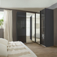 Rauch Lema 4 Door Sliding Corner Wardrobe - Basalt Glass - Styled in a Bedroom