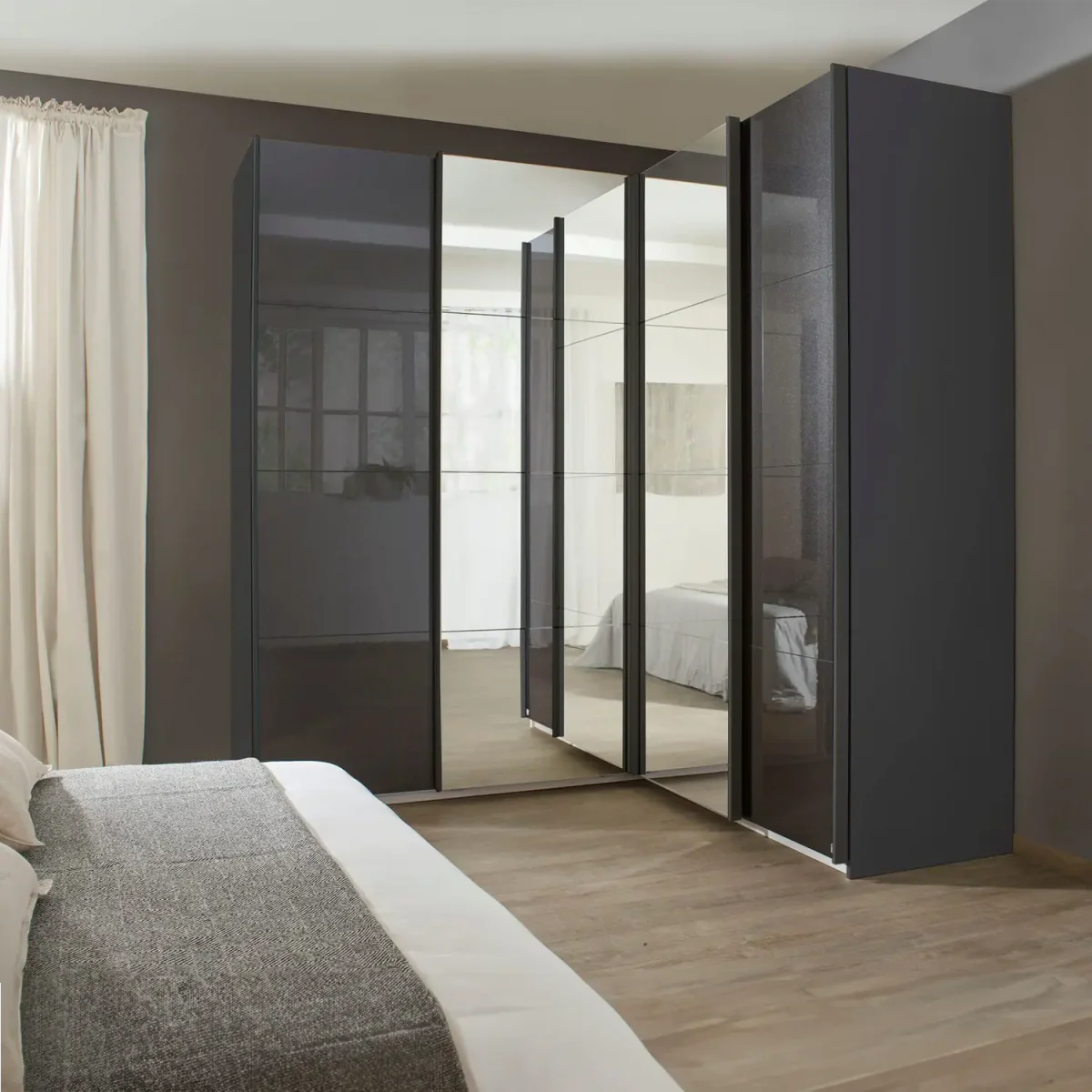 Rauch Lema 4 Door Sliding Corner Wardrobe - High Gloss Effect Grey - Styled in a Bedroom