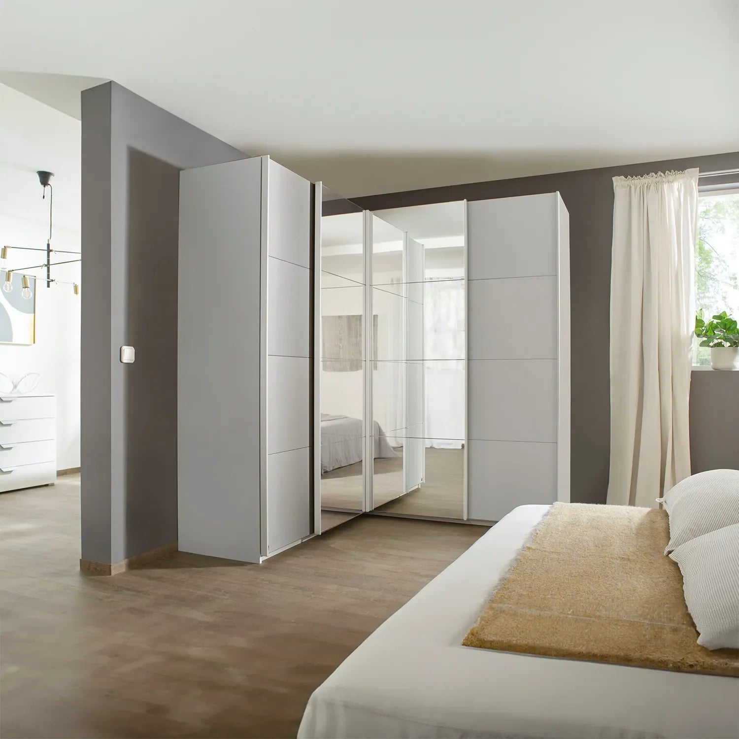 Rauch Lema 4 Door Sliding Corner Wardrobe - Silk Grey - Styled in a Bedroom
