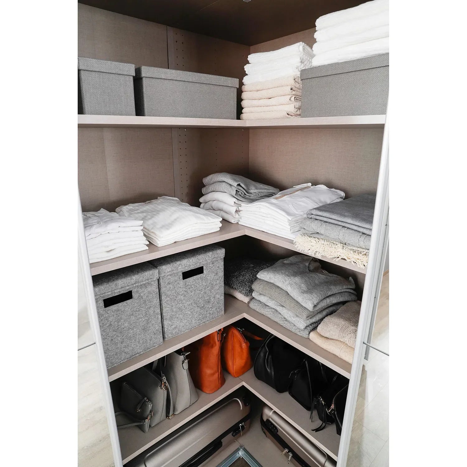 Rauch Lema 4 Door Sliding Corner Wardrobe - White High Gloss - Interior view Styled in a Bedroom