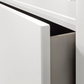 Close-up of a white leon cabinet with drawer